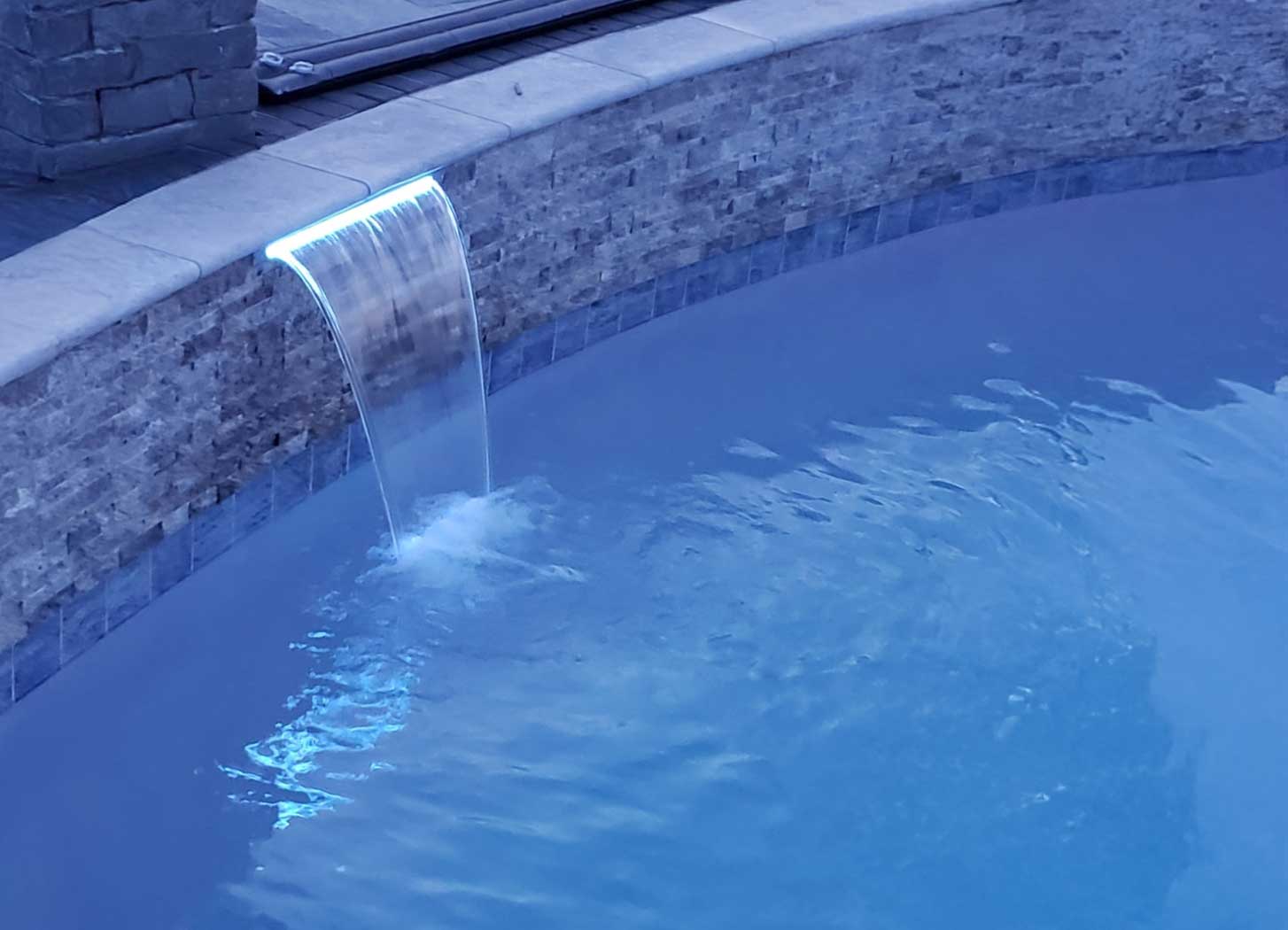 Pool waterfall feature installer
